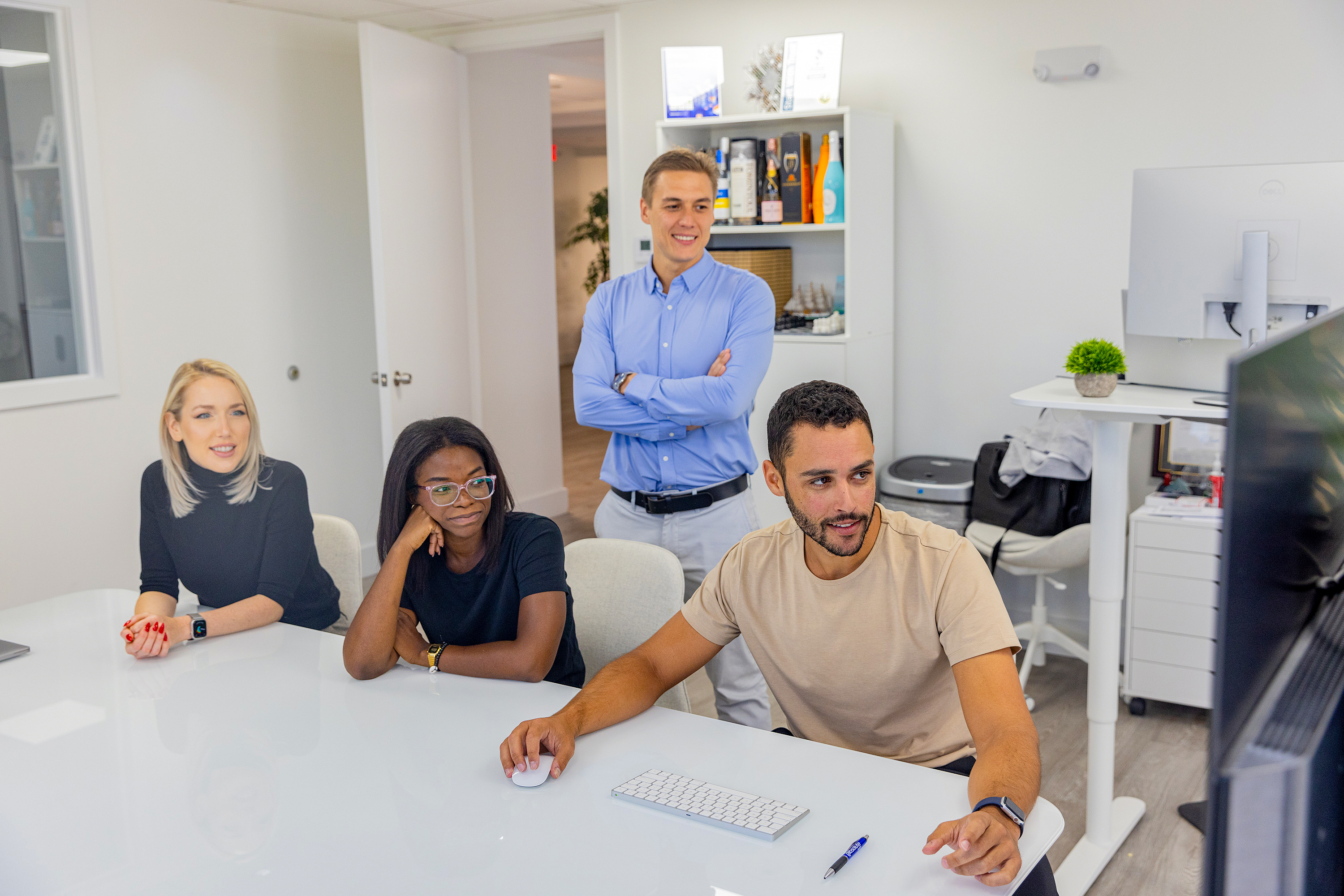 Absolute Web colleagues in a work meeting in the conference room